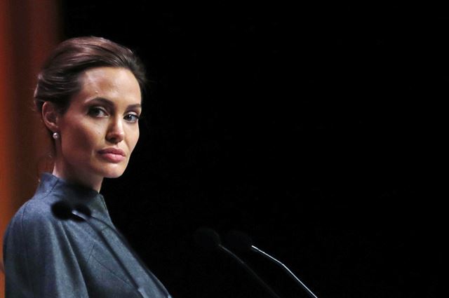 [PAP20140614005101034] US actress Angelina Jolie, Special Envoy of the United Nations High Commissioner for Refugees, attends a joint news conference at the conclusion of the 'End Sexual Violence in Conflict' summit in London, Friday, June 13, 2014. The Summit welcomed governments from over 100 countries, over 900 experts, NGOs, Faith leaders, and representatives from international organisations across the world. (AP Photo/Lefteris Pitarakis)