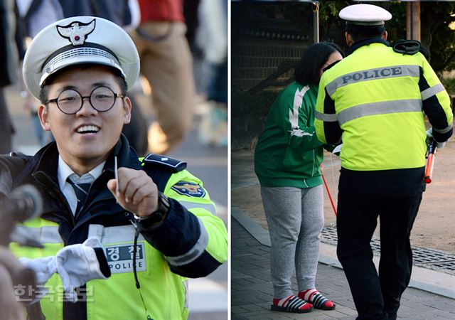 [저작권 한국일보]2016학년도 대학수학능력시험이 치러진 12일 오전 서울 종로구 안국동에 위치한 풍문여고에서 근무중이던 의경이 수험생이 차에 놓고 내린 신분증를 찾아 본인에게 전달해 주고 있다. 서재훈기자