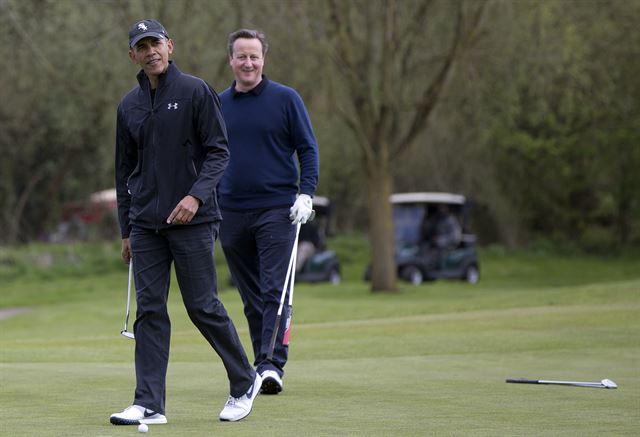 President Barack Obama and British Prime Minister David Cameron play the third green at the Grove Golf Course in Hertfordshire, England, Saturday, April 23, 2016. (AP Photo/Carolyn Kaster)