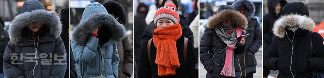 전국 곳곳에 한파특보가 내려진 12일 서울 광화문 네거리 인근에서 두터운 옷을 입은 시민들이 출근길을 재촉하고 있다. 서재훈기자 spring@hankookilbo.com