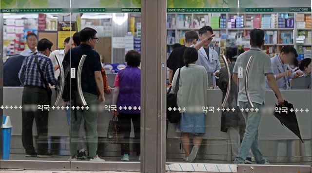 식품의약품안전처가 고혈압 치료제에 발암 유발 물질을 함유한 것으로 추정돼 판매 중지한 9일 오후 서울의 한 약국에 시민들이 붐비고 있다. 연합뉴스