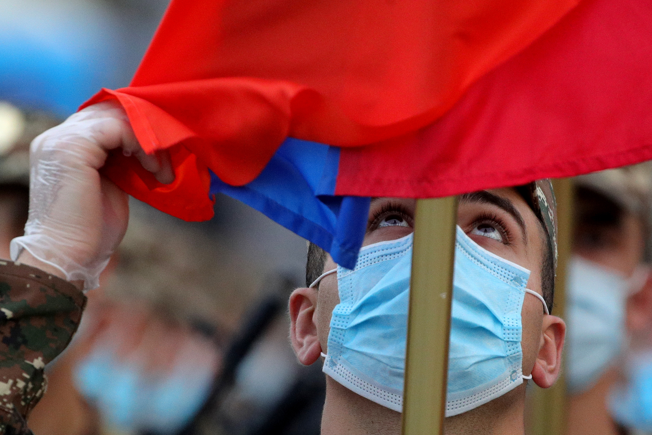 MOSCOW, RUSSIA - JUNE 18, 2020: A Moldovan serviceman holds a flag ahead of a rehearsal of the military parade marking the 75th anniversary of the victory over Nazi Germany in World War II in Moscow's Red Square. Victory Day parades across Russia have been postponed from May 9 to June 24 due to restrictions imposed to prevent the spread of the novel coronavirus. Sergei Bobylev/TASS/2020-06-19 17:20:19/