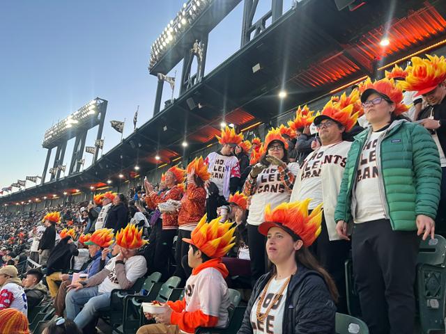 Members of Lee Jung-hoo’s fan club, Hoo Lee Gans, watch the game from the outfield seats Tuesday at Oracle Park in San Francisco. Hankook Ilbo