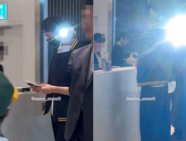 Actor Byeon Woo-seok’s bodyguard shines a flash toward passengers at Incheon International Airport, July 12 last year. Screenshot from X