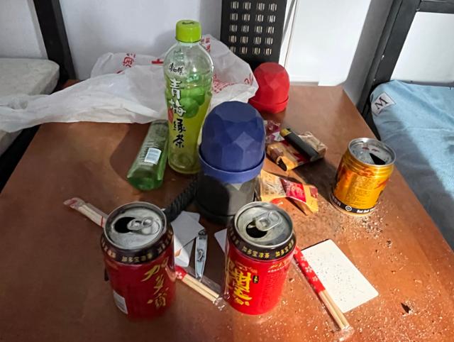 A room inside the Taizi compound in Takeo Province, Cambodia, on Thursday. Half-finished drinks and scattered belongings remain after the occupants fled. Hankook Ilbo