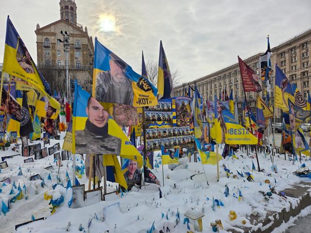Flags commemorating fallen soldiers flutter in the wind at Independence Square in Kyiv, Ukraine, on Feb. 18.  Korea Times photo by Jeong Seung-im 