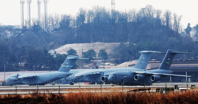 U.S. military transport aircraft including C-5 and C-17 planes are seen parked at Osan Air Base in Pyeongtaek, Gyeonggi Province, on March 6. Yonhap