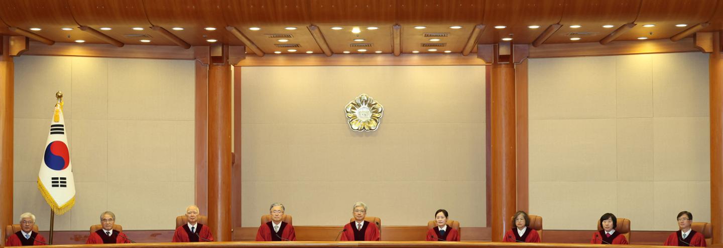 Constitutional Court President Kim Sang-hwan, center, and other justices sit in the courtroom at the Constitutional Court in Jongno District, Seoul, on Thursday, ahead of rulings on constitutional complaints. Yonhap